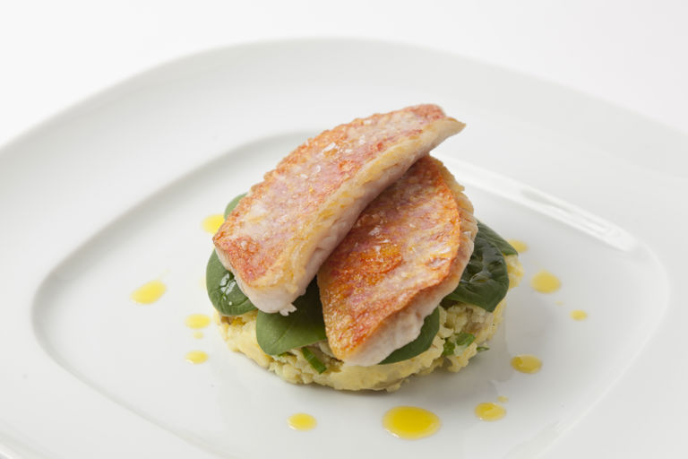 Pan-fried red mullet with baby spinach salad and crushed Caesar new potatoes