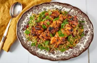 Yoghurt-marinated grilled chicken skewers with jewelled bulgur wheat salad