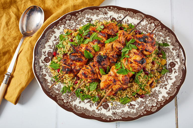 Yoghurt-marinated grilled chicken skewers with jewelled bulgur wheat salad