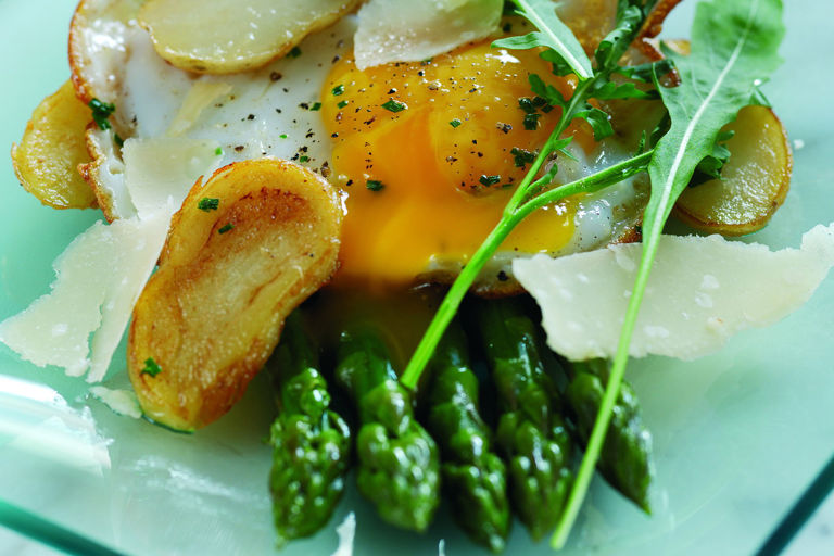 Sauté of Jersey Royals with fried duck egg and griddled asparagus and Parmesan salad