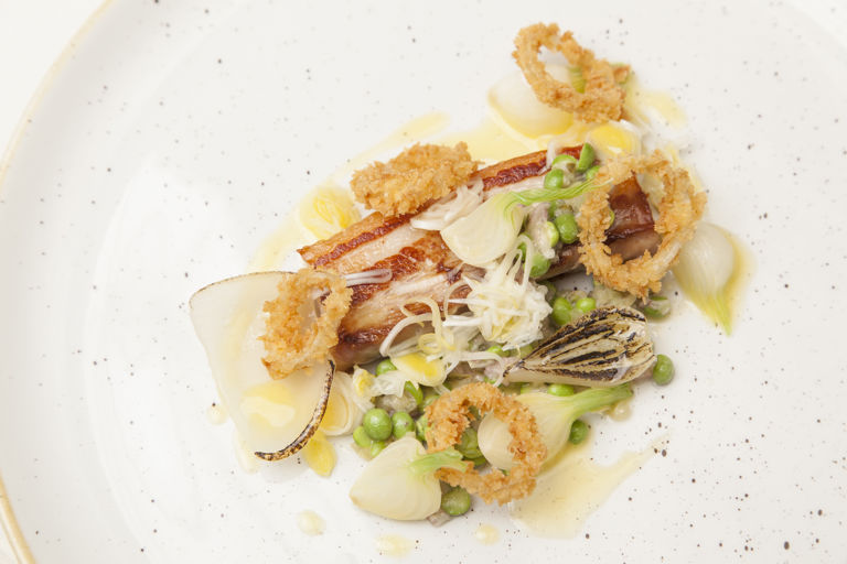 Slow cooked pork belly, pea tartare, onions