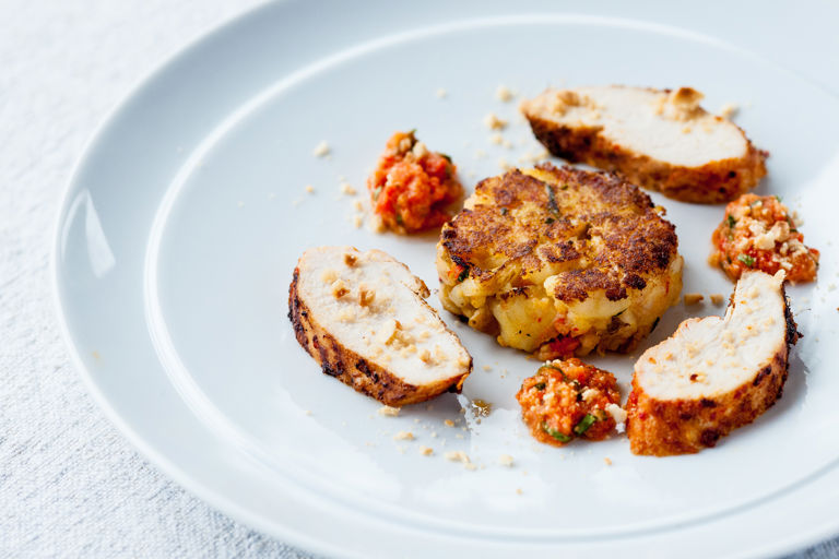 Chargrilled chilli chicken breast with Jersey Royals and romesco cakes