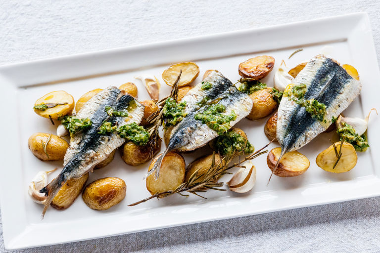 Grilled sardines with garlic roasted Jersey Royals and salsa verde