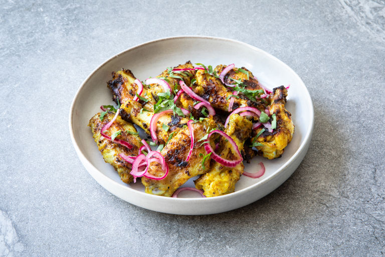 Curried BBQ wings with quick pickled red onions