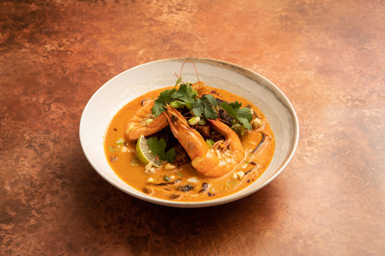Thai-style coconut curry soup with peanut croutons