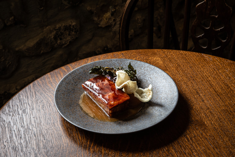 Glazed pork belly with malt vinegar kale, apple butter and crispy pork quaver