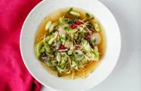 Asian-style aromatic vegetable broth with soft noodles, pak choi and shiitake mushrooms  