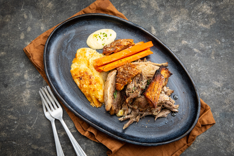 Slow-cooked pork shoulder with apple purée and crackling