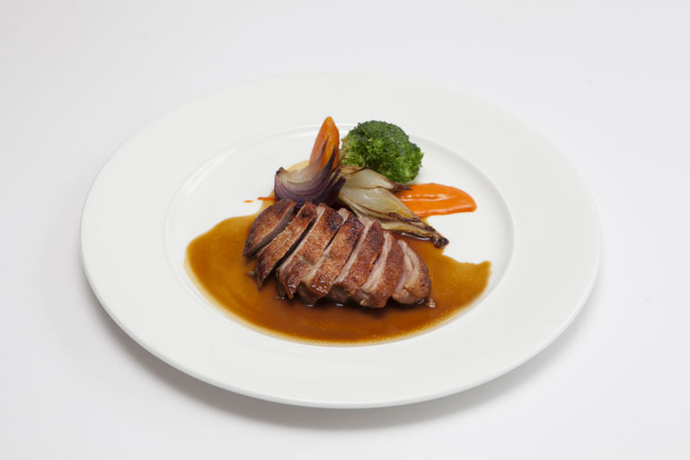 Duck breast with mildly spiced sauce