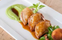 Breasts of quail with pea purée, pancetta and marjoram jus