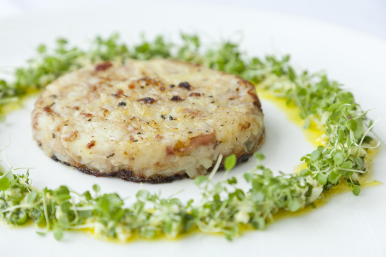 Smoked bacon potato cakes with soft egg dressing and watercress salad