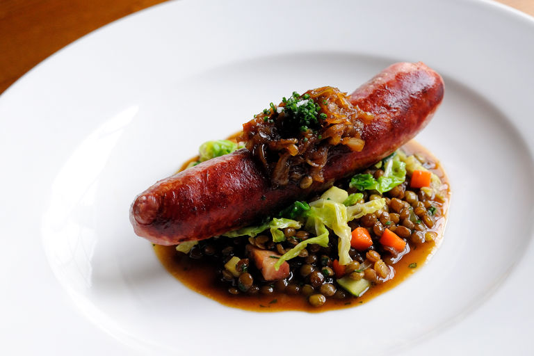 Toulouse sausage with braised lentils