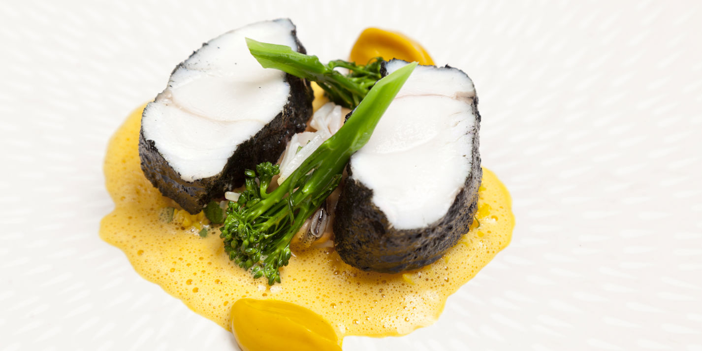 Monkfish tail with blackened spices, cracked wheat and lightly spiced mussels