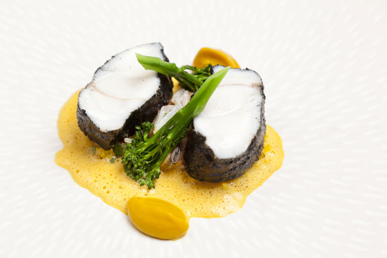 Monkfish tail with blackened spices, cracked wheat and lightly spiced mussels