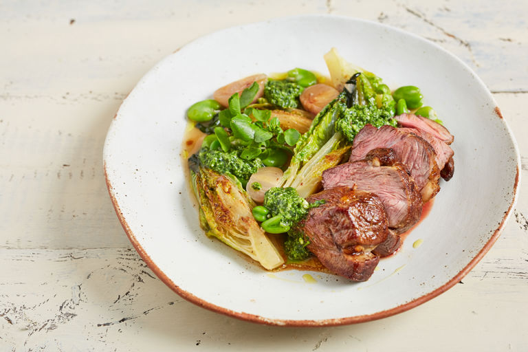 Lamb rump with watercress and roast garlic pesto, braised baby gem lettuce and broad beans