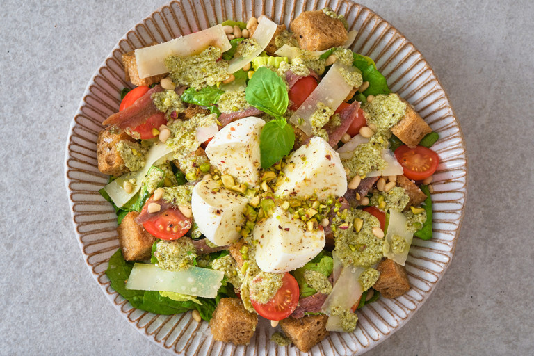 Tomato, mozzarella and anchovy salad with pesto dressing