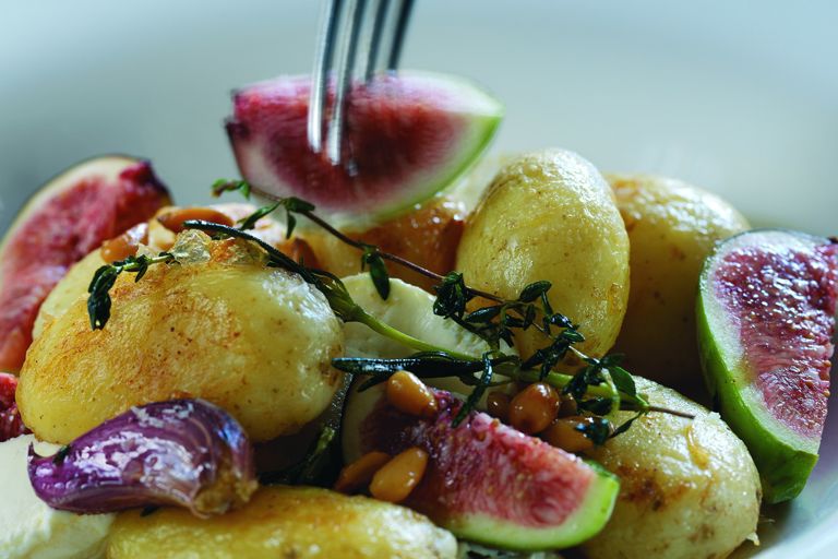 Warm salad of Jersey Royals with goat's cheese, pine nuts and fresh figs