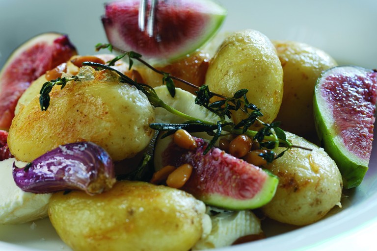 Warm salad of Jersey Royals with goat's cheese, pine nuts and fresh figs