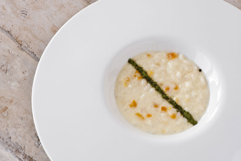 Risotto with caciocavallo cheese, apricots, coffee and celery powder