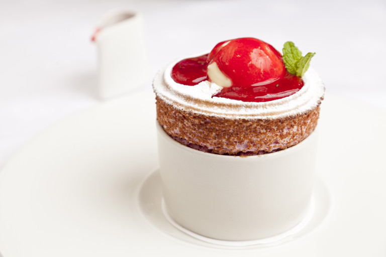 Raspberry soufflé with buttermilk ice cream and raspberry and mint coulis