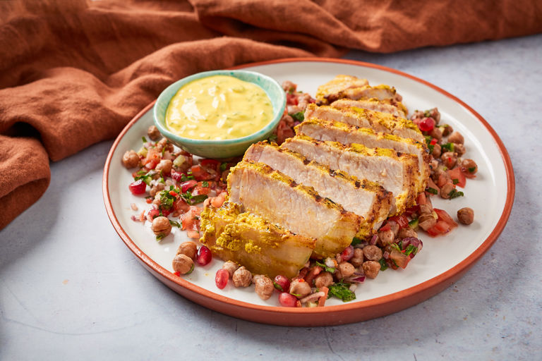 Curried pork chops with spiced chickpea salad and mint yoghurt
