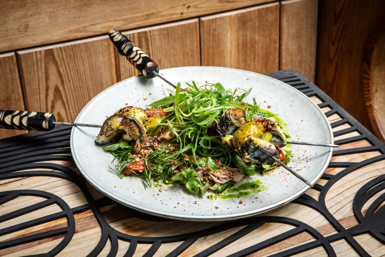 Amba-spiced mackerel skewers, green tarator, fennel and tomato salad