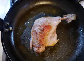 Crisp the skin of the legs in a hot pan