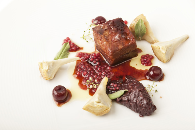 Pork secretos with artichokes and red wine tapioca