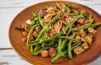 Charred green beans with sauté potatoes, chermoula and fried almonds
