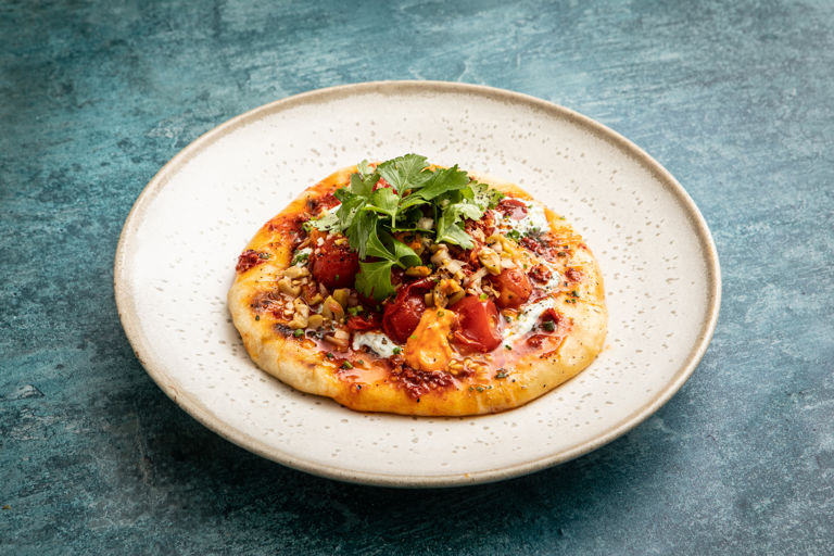 Fermented Piccolo cherry tomato bruschetta on toasted sourdough flatbreads with parsley yoghurt and 'nduja aioli 