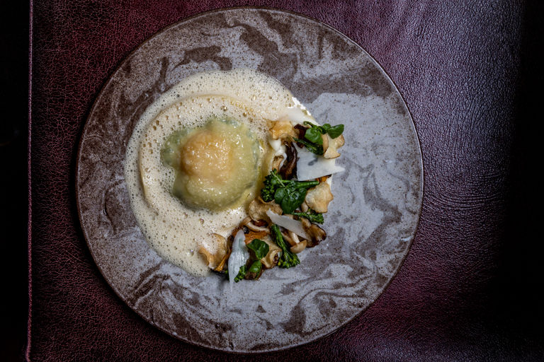 Watercress and egg yolk ravioli with wild mushroom fricassee
