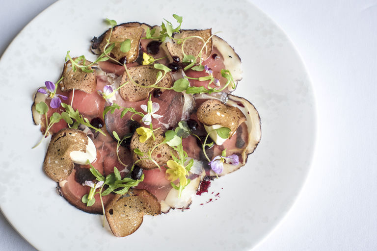 Bresaola of silverside with blackcurrants, ricotta and rocket