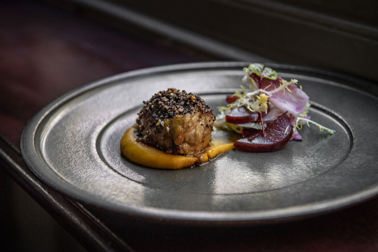 Veal sweetbreads with black pudding and walnut crumb and spiced carrot purée