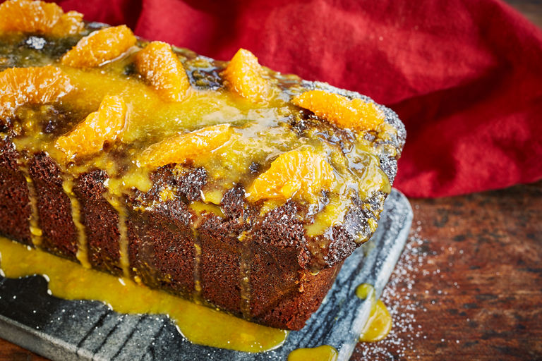 Spelt, ginger and treacle loaf with clementine icing