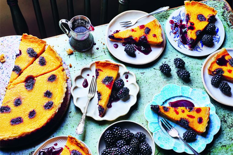 Saffron and bay custard tarts with sticky blackberries