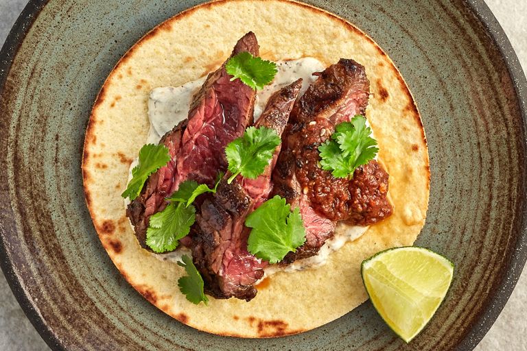 Beef onglet taco with spring onion crema, morita salsa and coriander