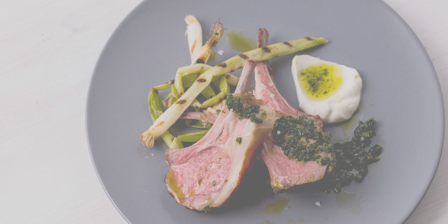 Sous vide rack of lamb with zhug, buttermilk and grilled spring onions