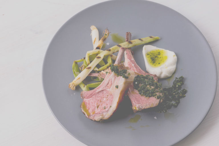 Sous vide rack of lamb with zhug, buttermilk and grilled spring onions