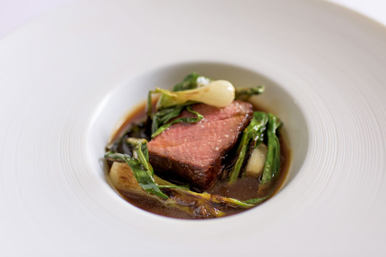 Barbecue beef sirloin, grilled onions and caramelised onion broth