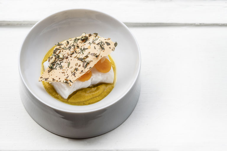 Steamed cod with squash purée and a yoghurt and pumpkin seed cracker