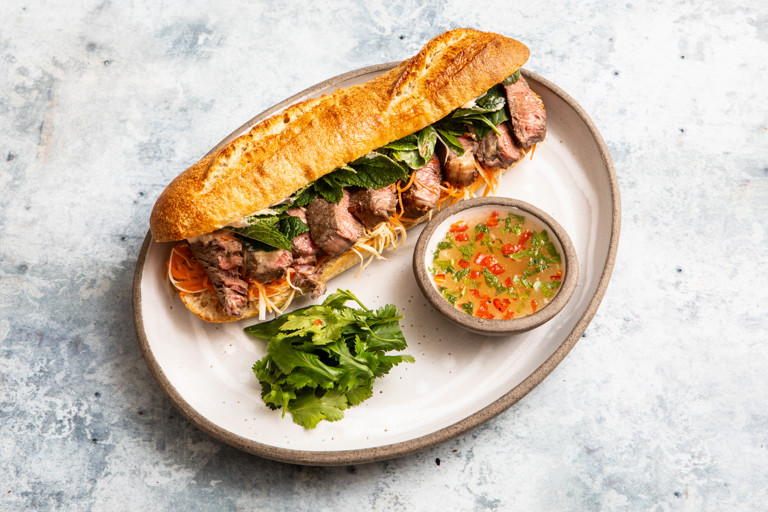 Lemongrass steak bánh mì and herb salad