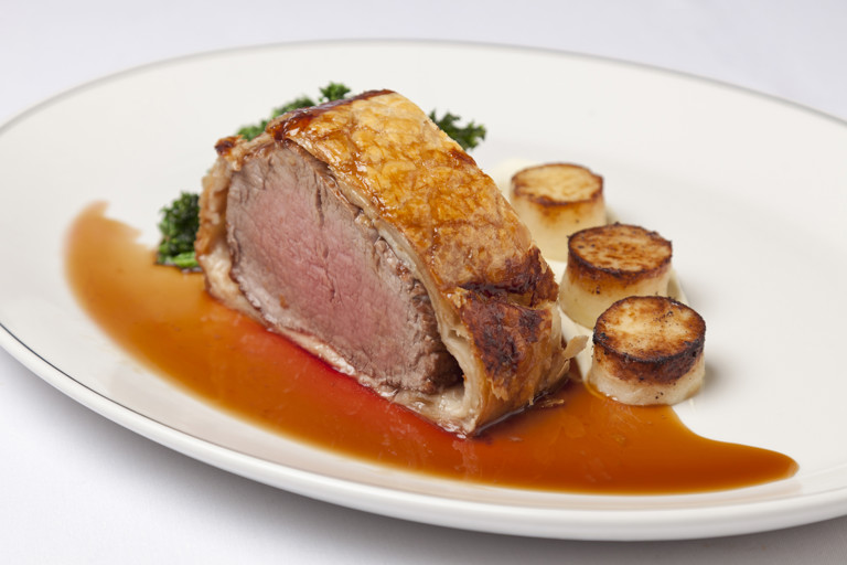 Fillet of beef wellington with parsley root purée mini fondants, sautéed kale and rosemary jus