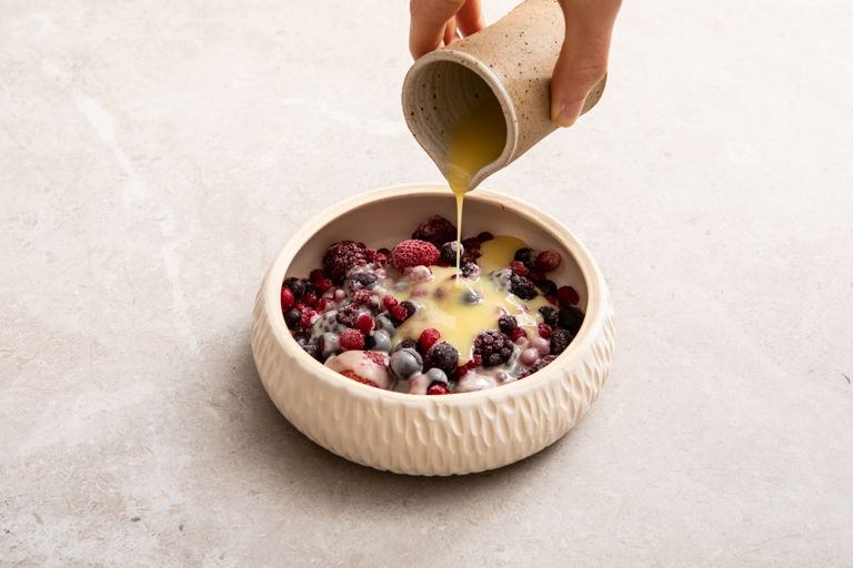 Frozen berries with white chocolate and coconut sauce