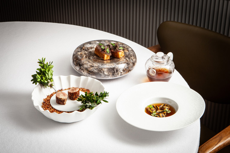 Quail tortellini and stuffed quail with mushroom consommé and quail liver parfait brioche