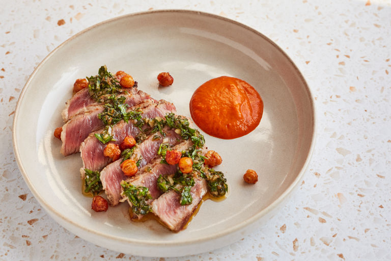 Iberico pork presa with chimichurri and red pepper purée