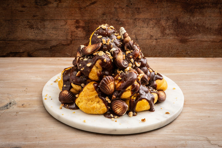 Profiteroles with hazelnut brittle and chocolate shells