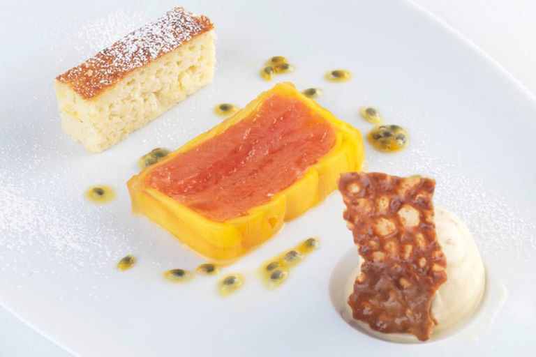 Red grapefruit and mango press, ginger ice cream, ricotta cake and almond brittle