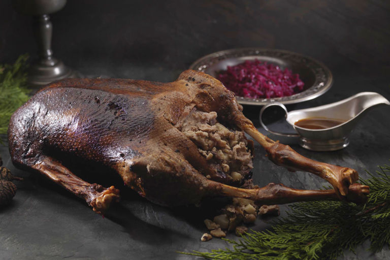 Roast goose with chestnut and pear stuffing and braised red cabbage