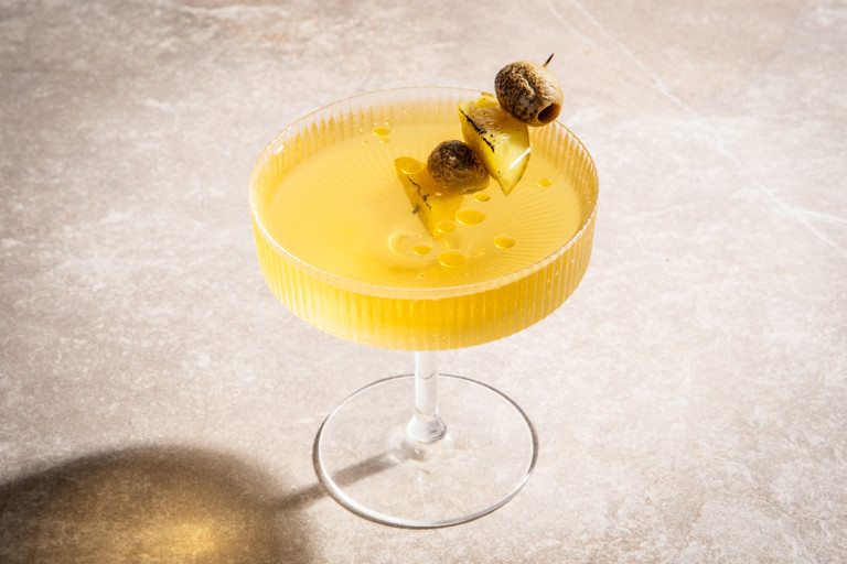 Dirty dill martini with charred skewer