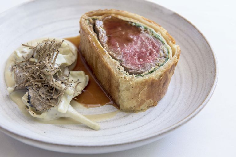 Beef Wellington with warm baby artichokes and a truffle vinaigrette